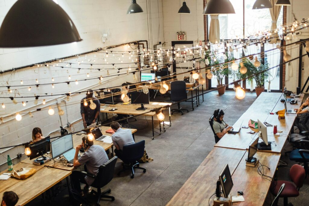 People in coworking space. Photo by Shridhar-Gupta from Unsplash https://unsplash.com/photos/people-sitting-in-front-of-computer-monitors-dZxQn4VEv2M